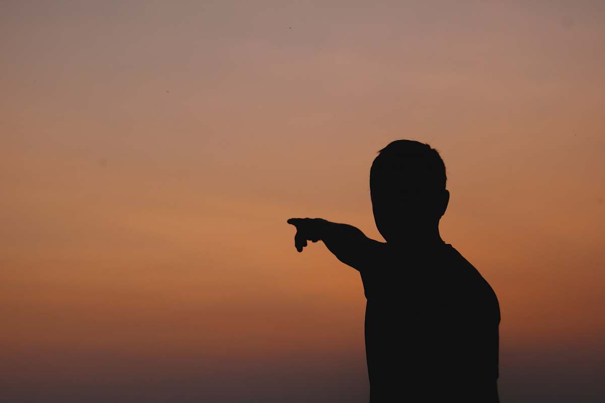 human silhouette of person pointing hand person