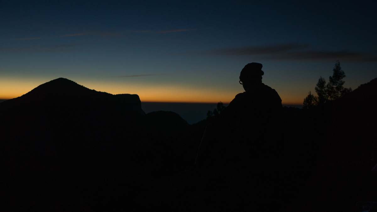 munnar silhouette of person sitting during nighttime india