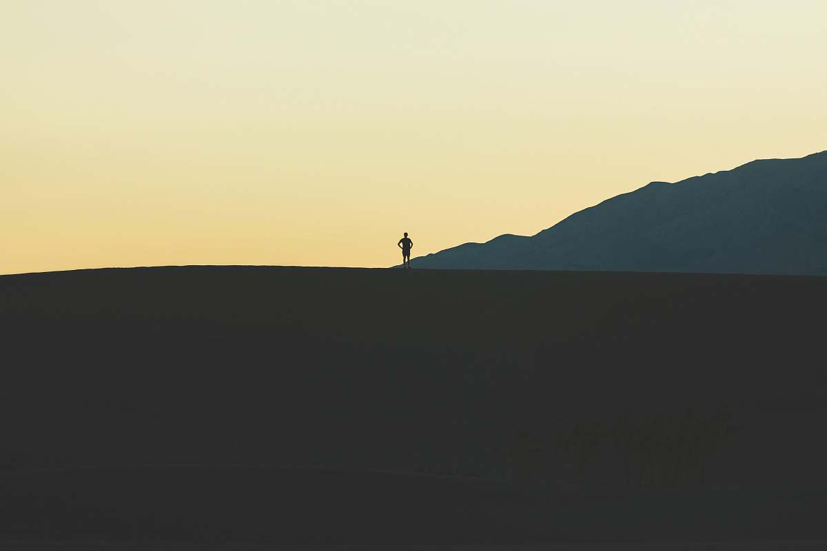 nature silhouette of person standing on mountain person