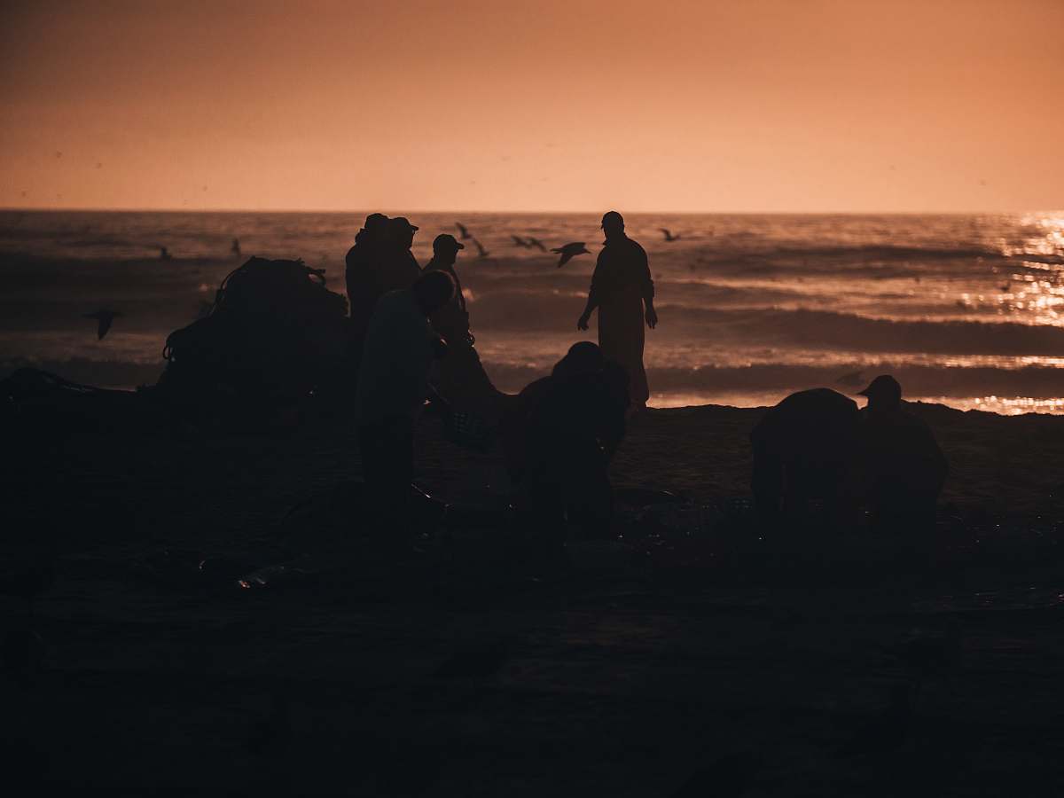 person silhouette of person standing on seashore human