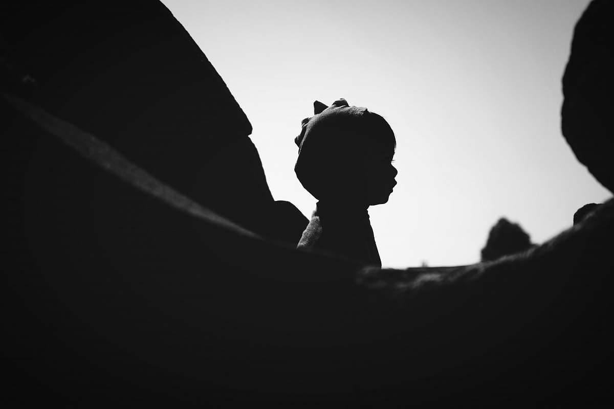 black-and-white silhouette of statue during daytime human