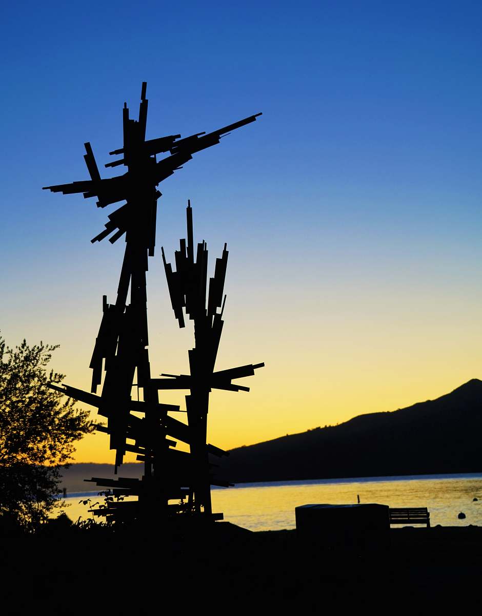 nature silhouette of tower beside body of water outdoors