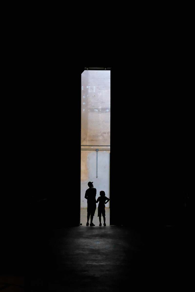 people silhouette of two persons standing between doors iphone wallpapers