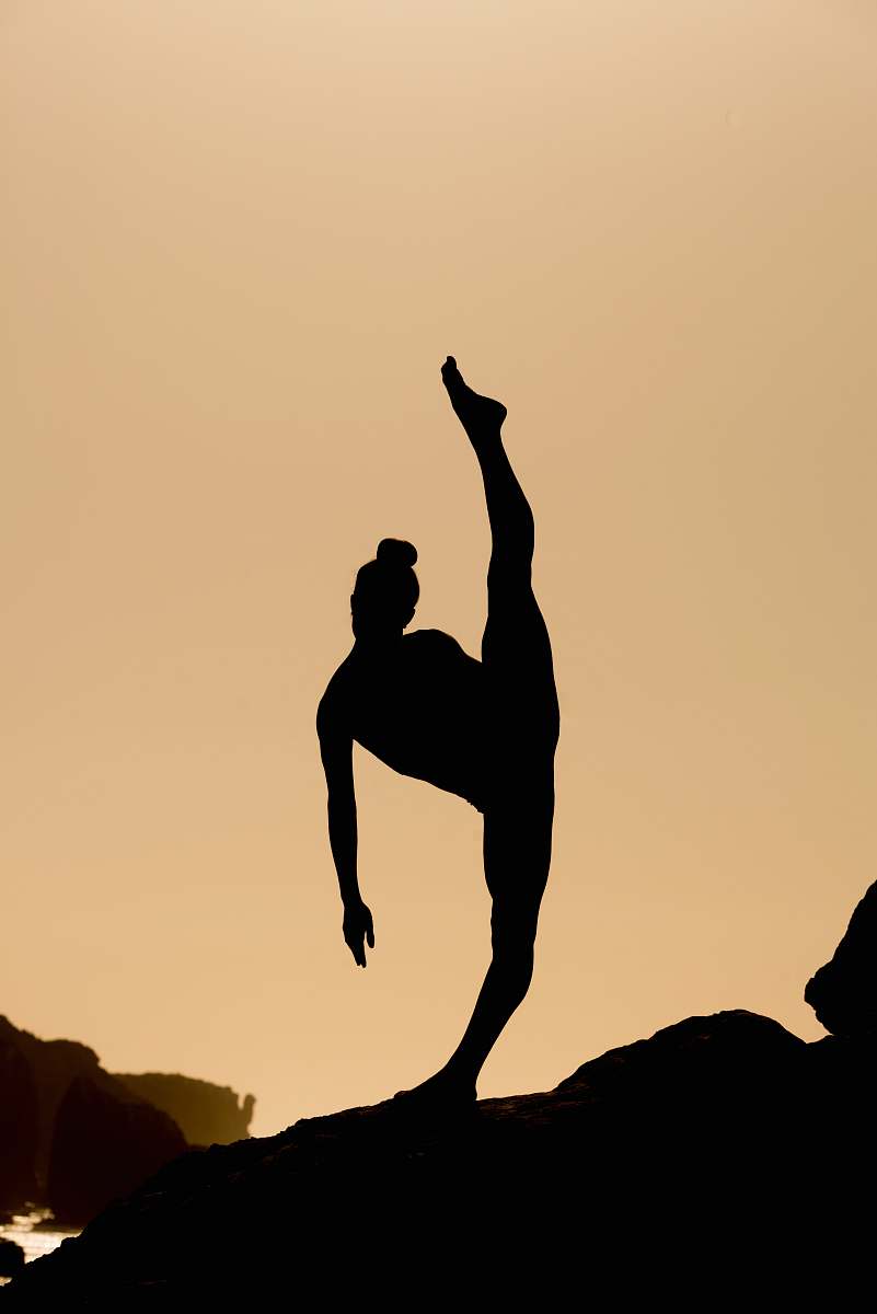 malibu silhouette of woman doing oga yoga