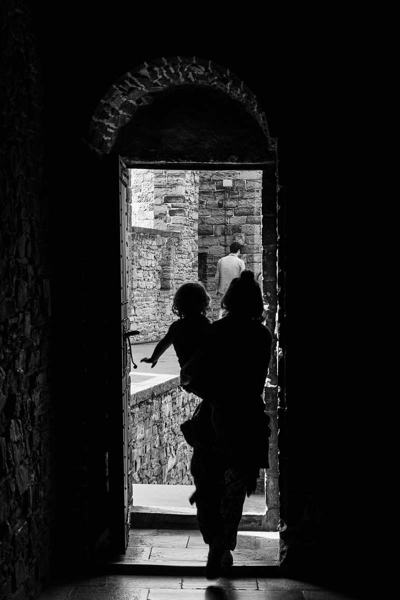 human silhouette of woman holding baby black-and-white