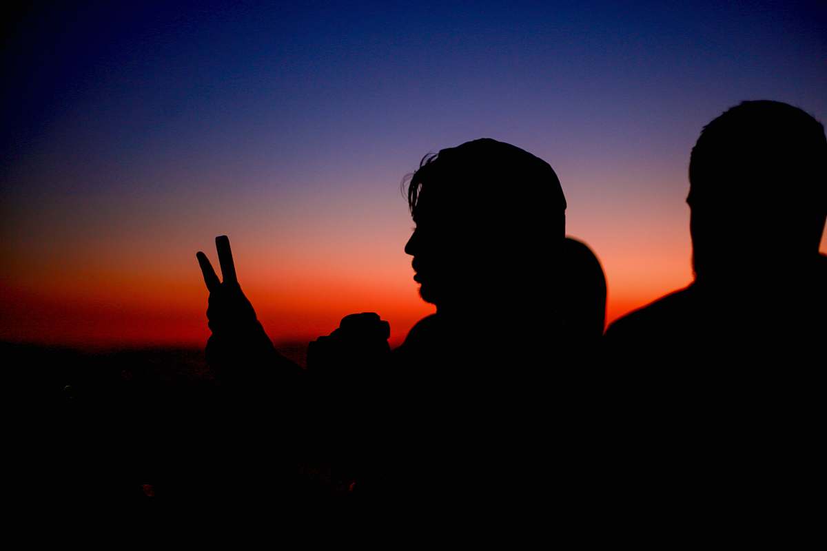 human silhouette of woman holding smartphone person