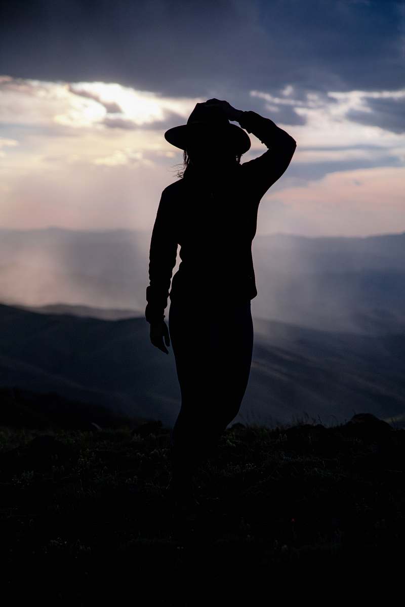 apparel silhouette of woman near mountains clothing