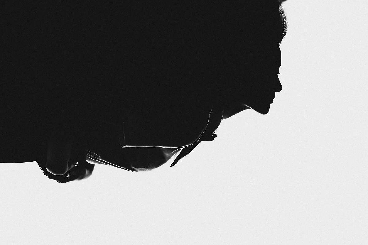 black-and-white silhouette of woman on white background hair