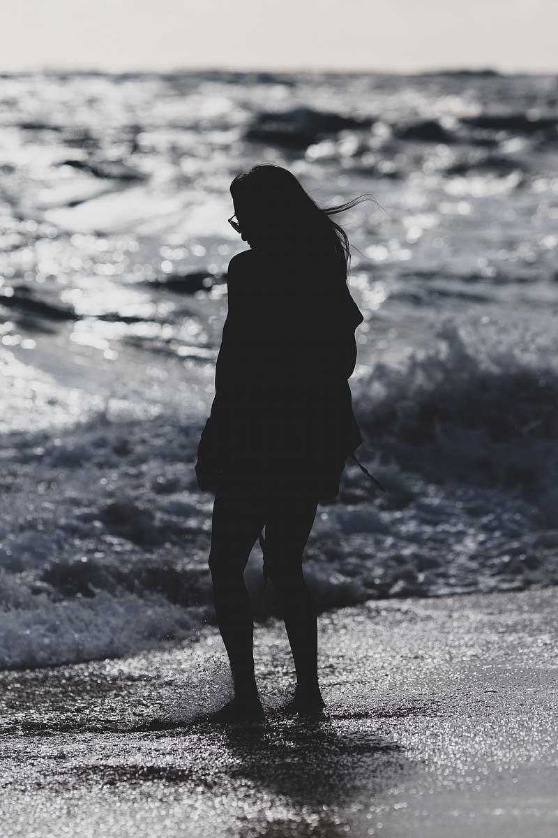 standing silhouette of woman standing on seashore person
