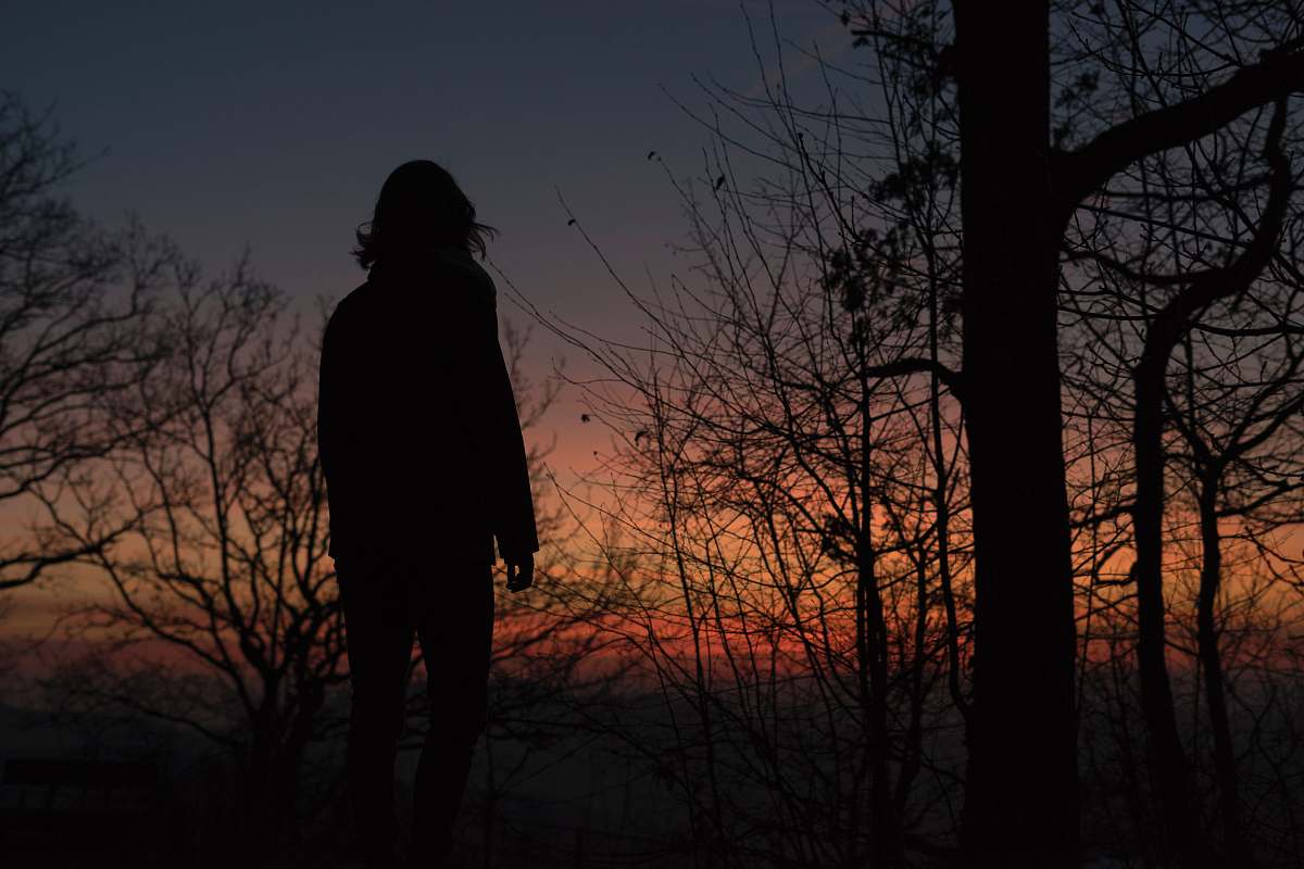 human silhouette photo of a woman on sunset person