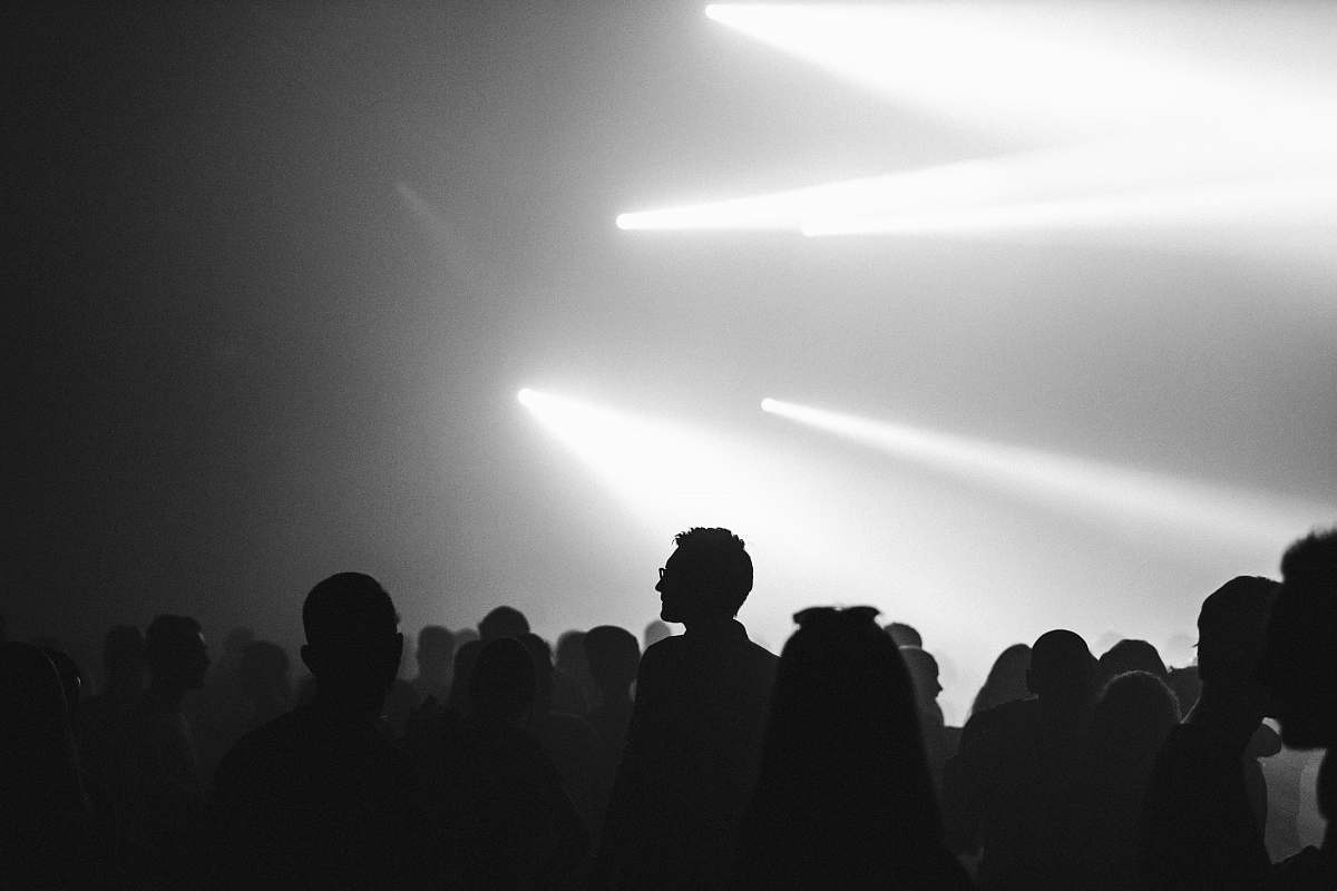 black-and-white silhouette photo of crowded people amsterdam