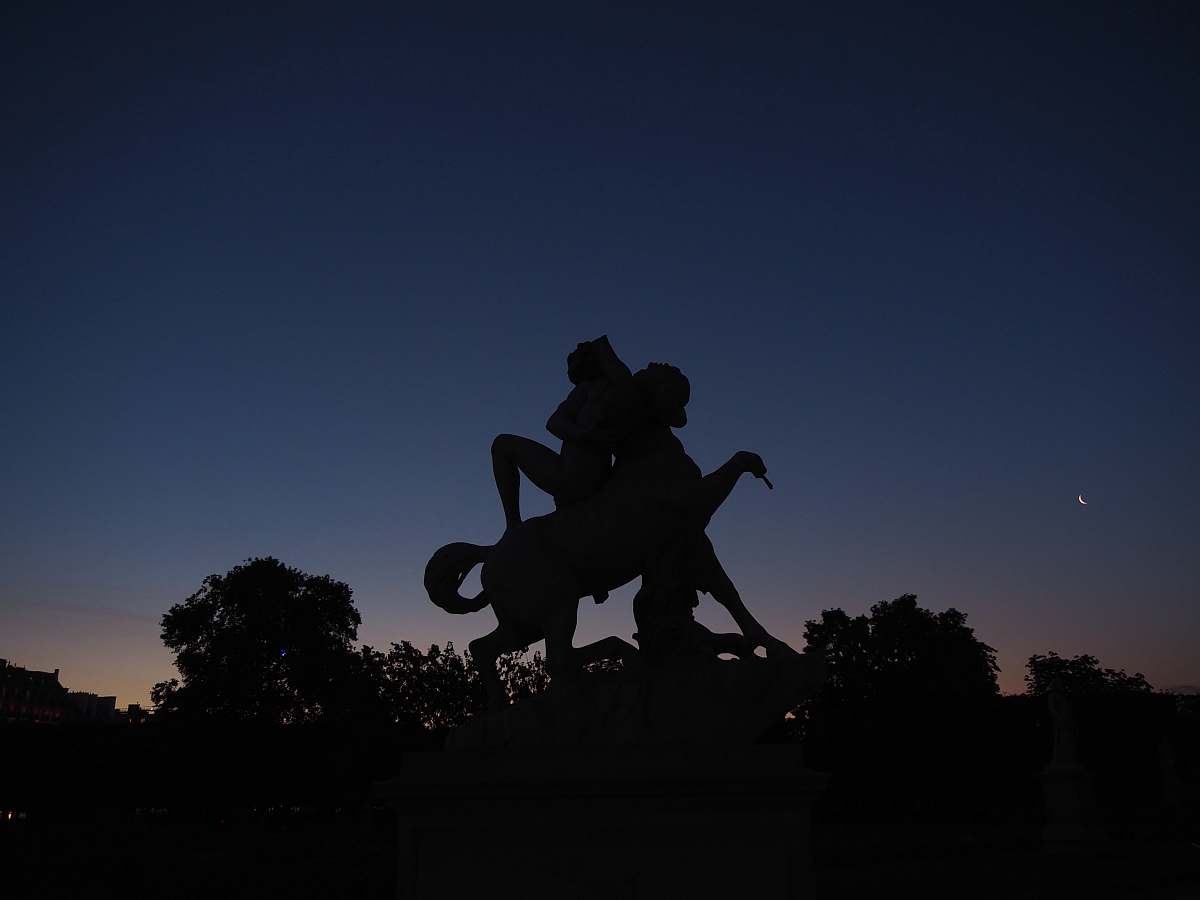 statue silhouette photo of man riding horse statue monument