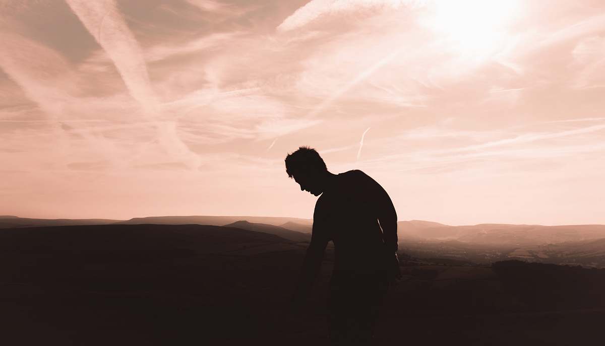 sunset silhouette photo of man sunrise