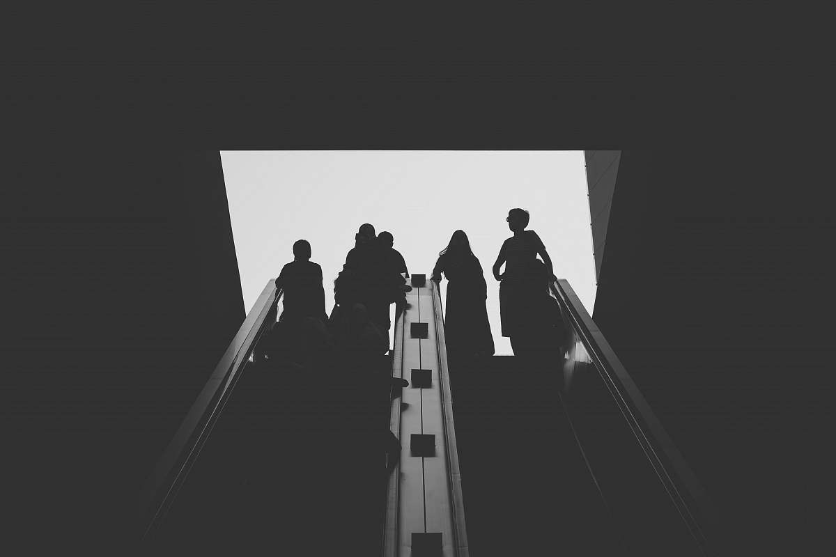 black-and-white silhouette photo of person grey