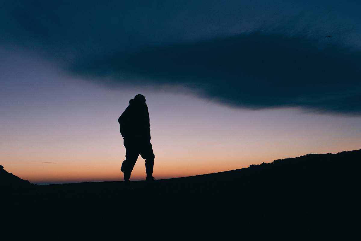 human silhouette photo of person walking person