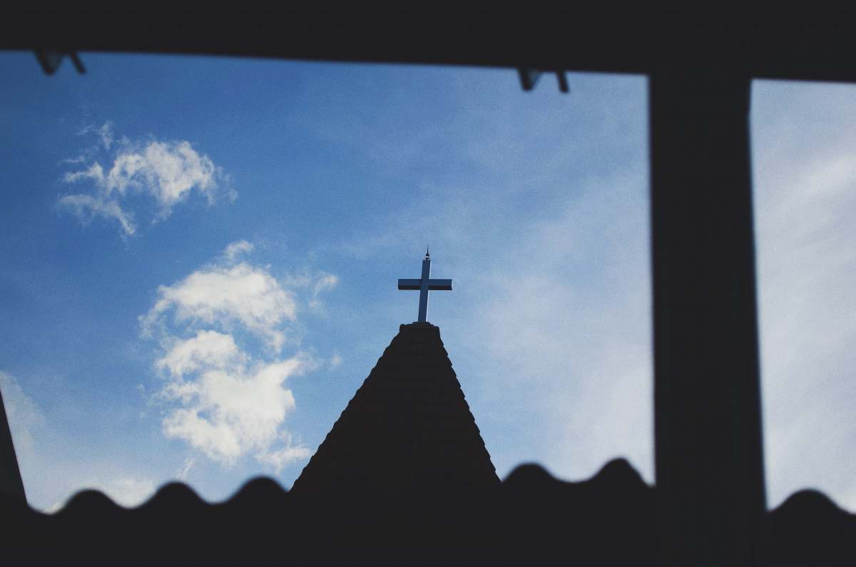 architecture silhouette photography of a cross during daytime building