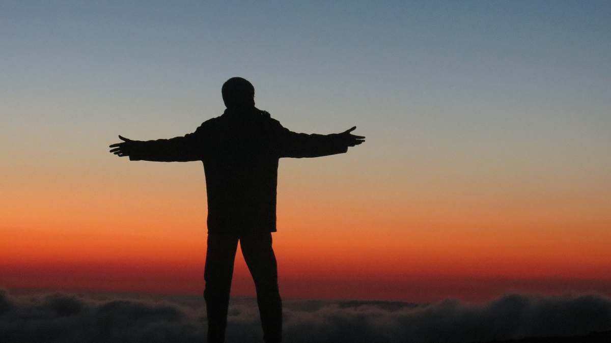 human silhouette photography of man spreading his arms on air person