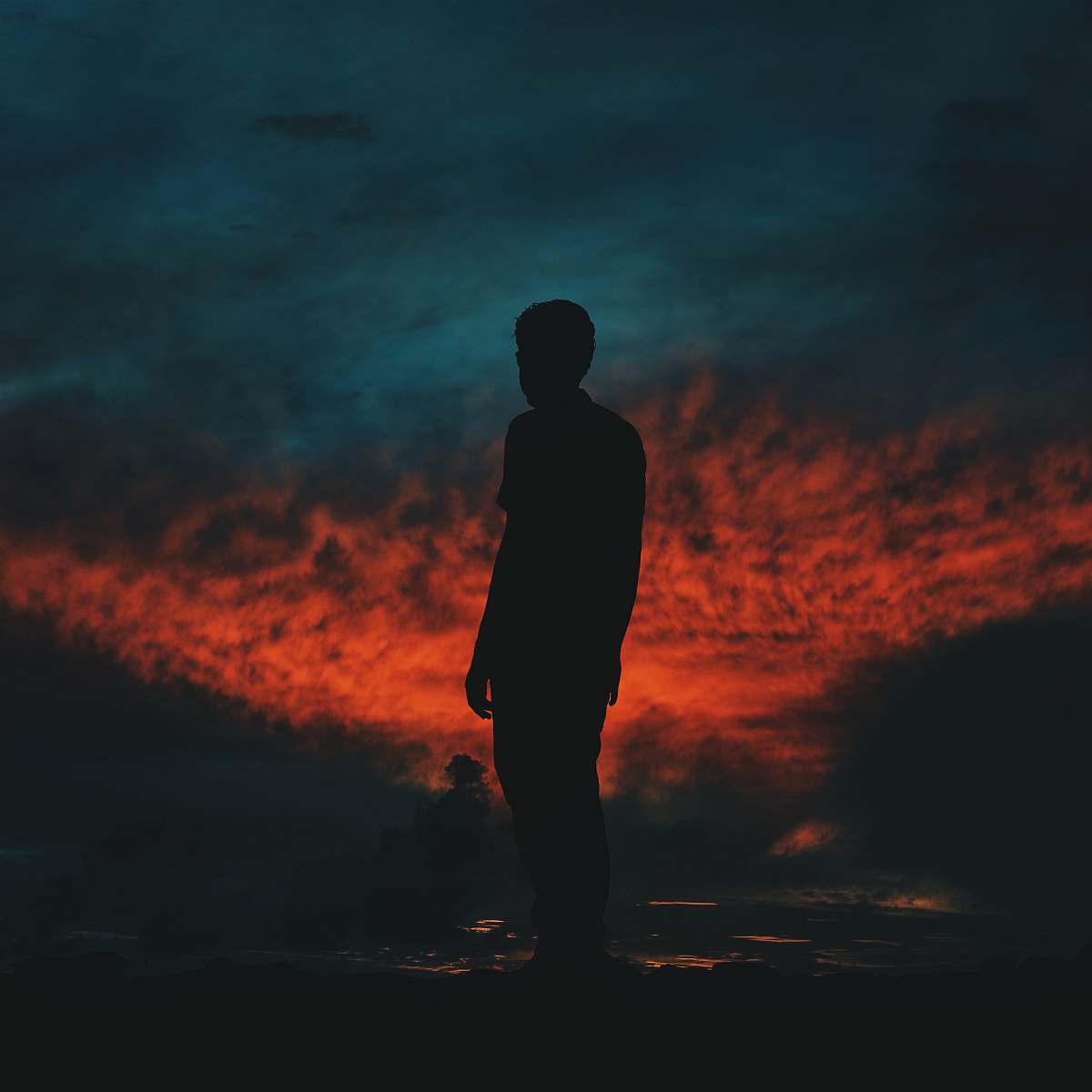 person silhouette photography of man standing on ground people