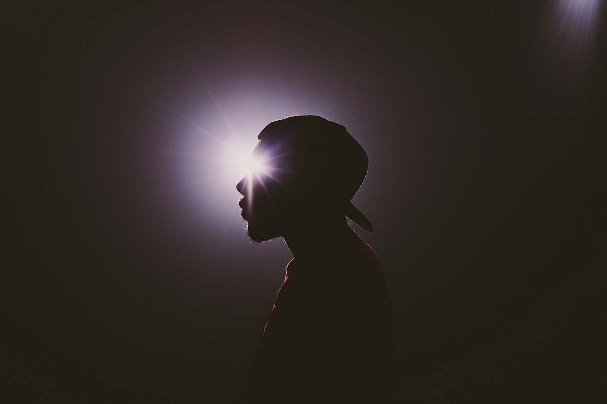 Light Silhouette Photography Of Man Wearing Cap Shadow Image Free Photo