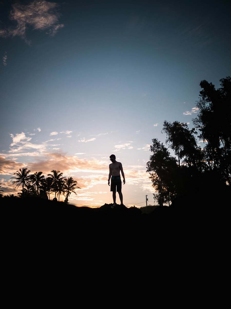 person silhouette photography of person standing under blue sky human
