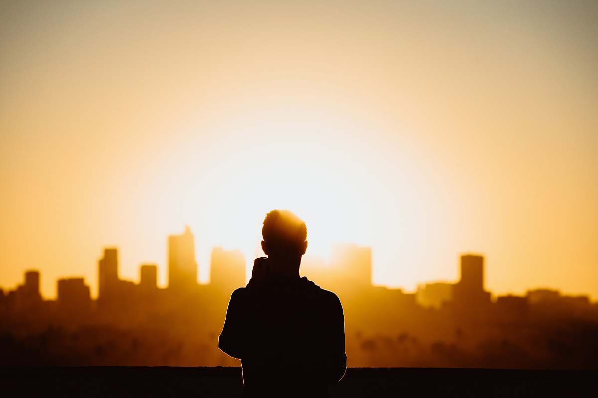 person silhouette photography of standing person during sunset human