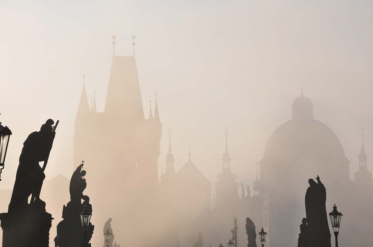 grey silhouette photography of statues \ prague