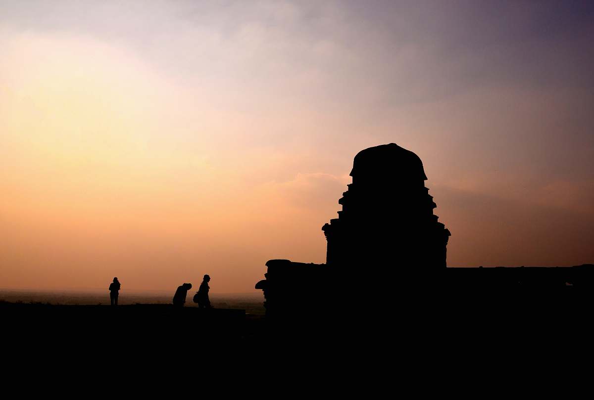 human silhouette photography of three people near building nature
