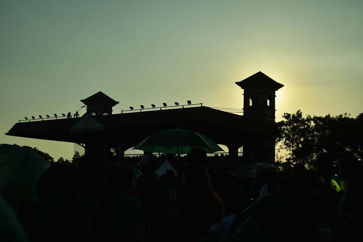 person silhouette photography of tower human
