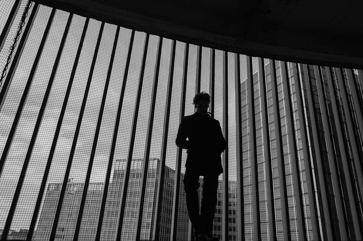 human silhouette photography unknown person standing indoors black-and-white