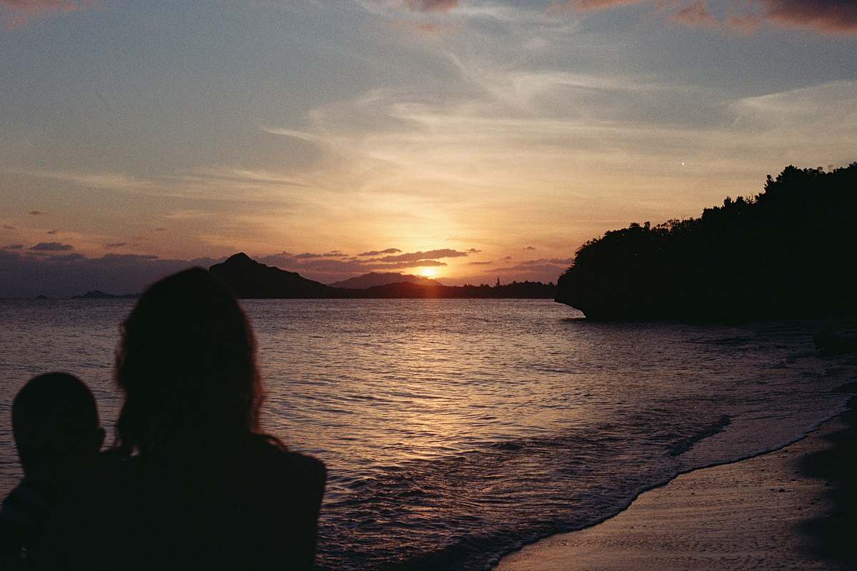 sky two person near body of water at golden hour sunrise