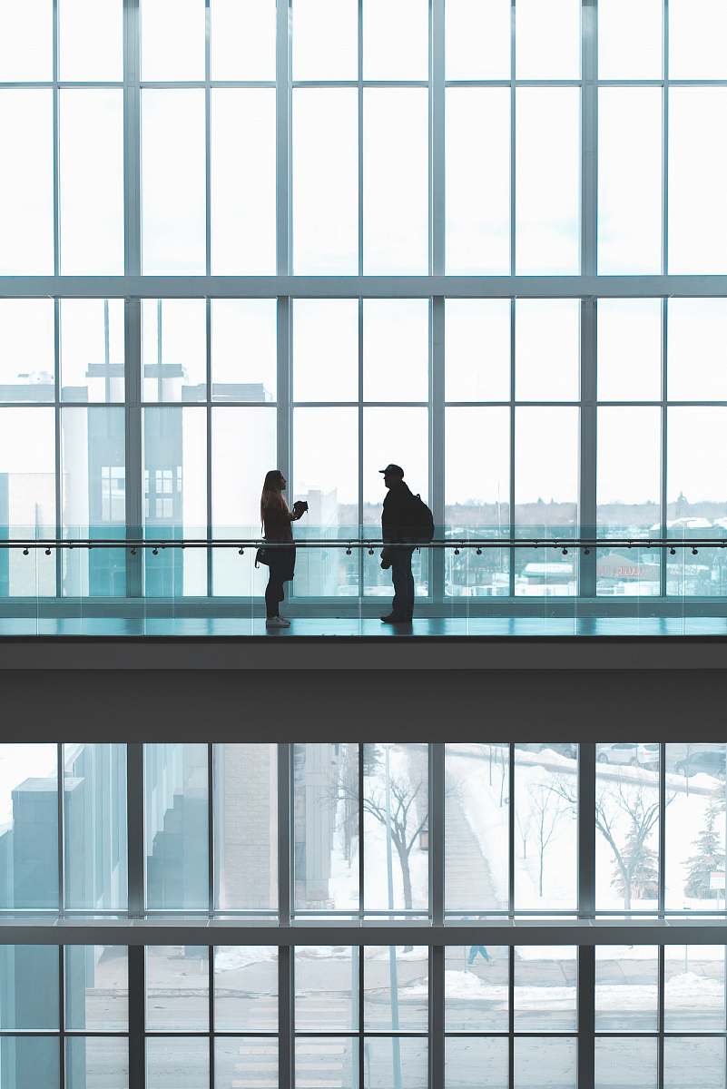 terminal two person talking to each other airport terminal