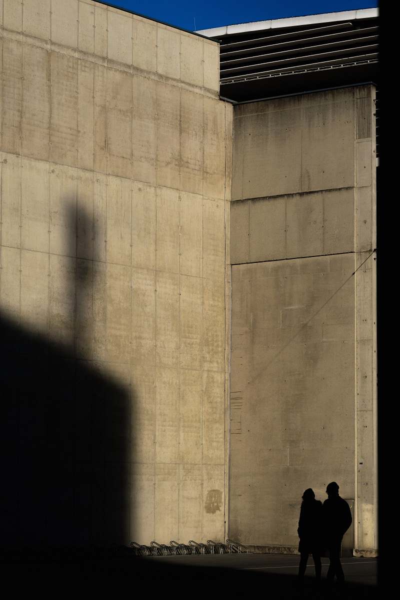 human two silhouette of person standing near wall person