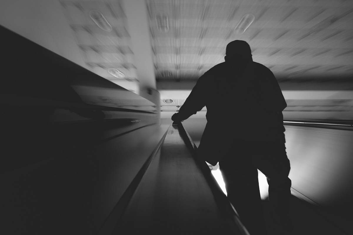 black-and-white unknown person silhouette photography corridor
