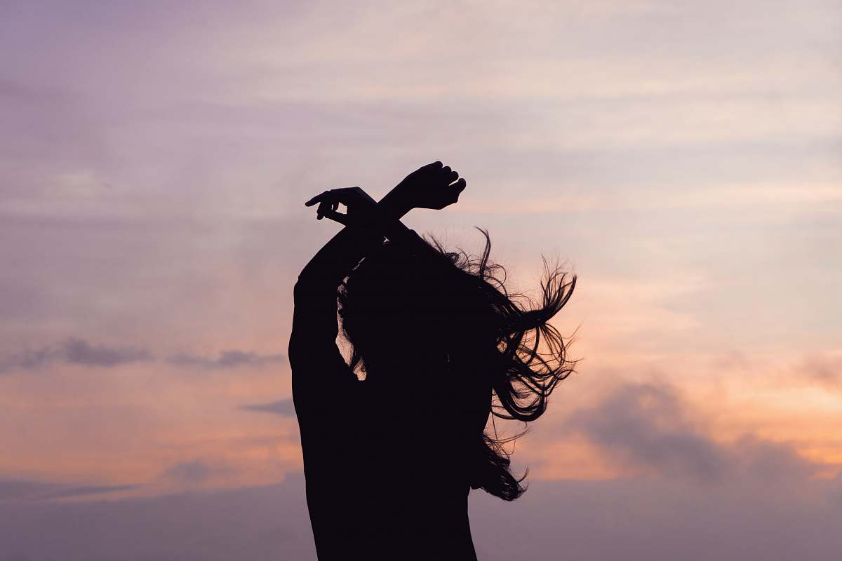 nature woman waving her hair outdoors