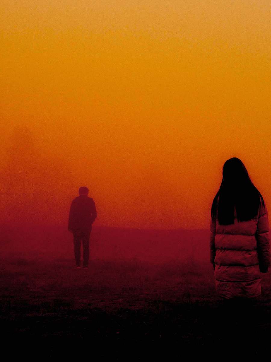 human woman wearing coat looking the boy about to walk to away person