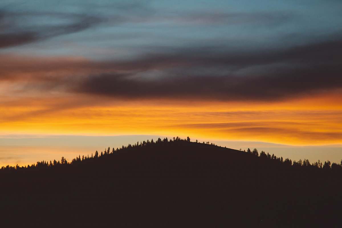 sunrise black mountain at daytime sunset