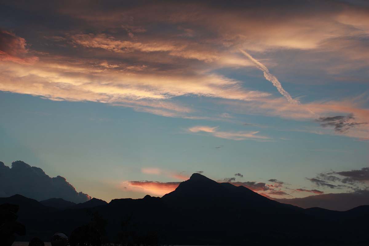 sunrise silhouette of mountain under cloudy sky sunset