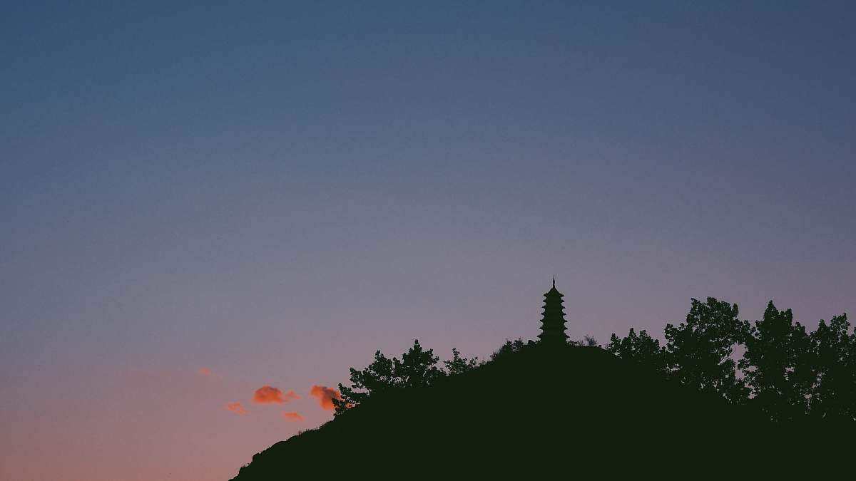 sunrise silhouette of mountain with building sunset