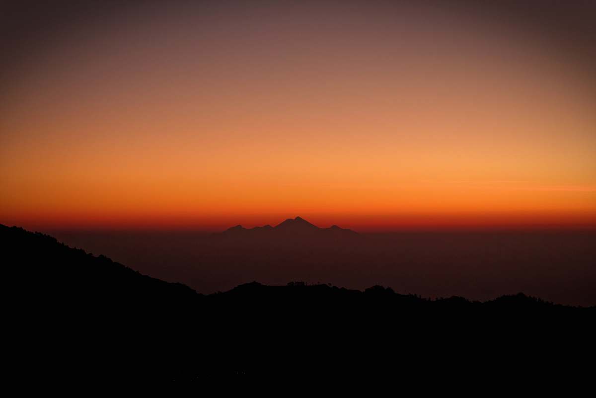 sunrise silhouette photography of mountains during sunset sunset