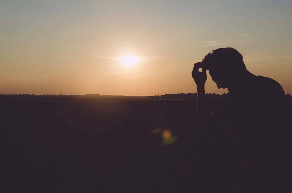 sunrise silhouette of man during daytime silhouette