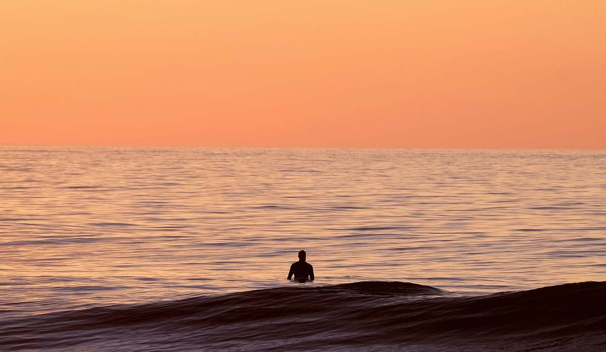 sea silhouette of person in body of water ocean