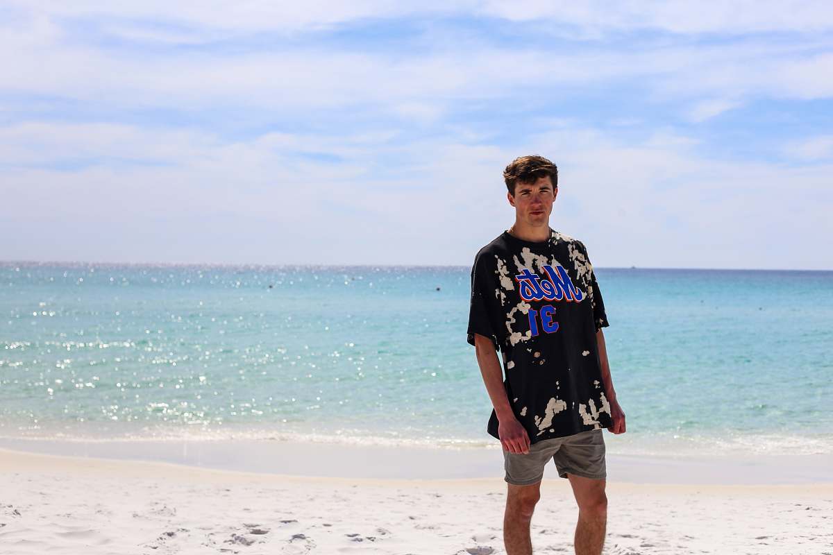 ocean man standing on beach sea