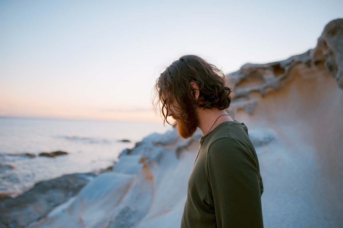 man man in green shirt on seaside male