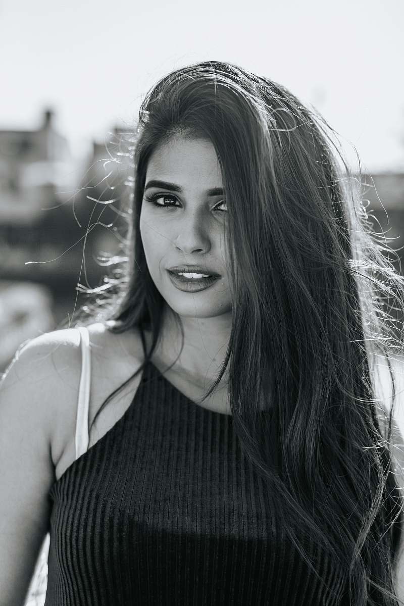 human grayscale photo of woman in cami-strap top people