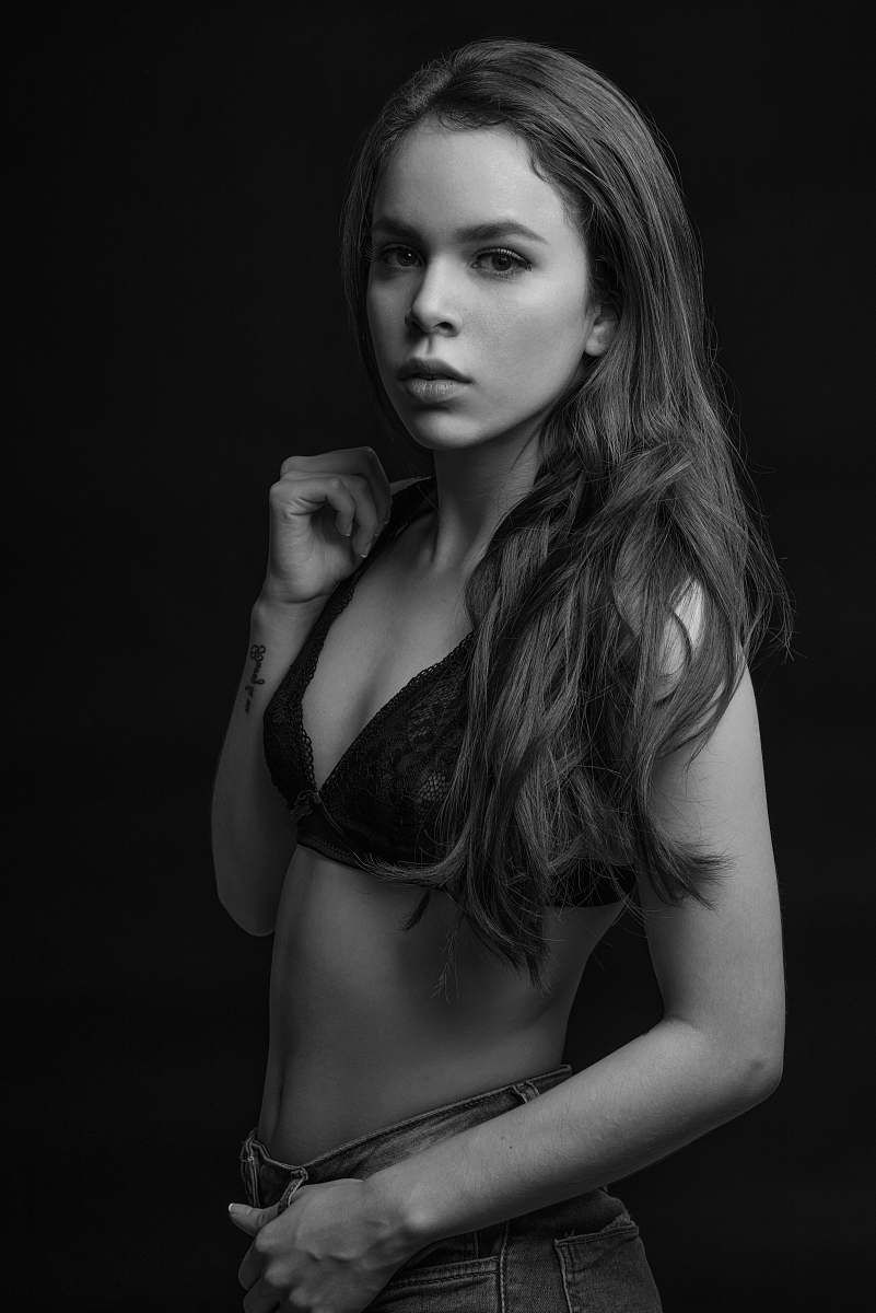 person grayscale photography of woman wearing brassiere people