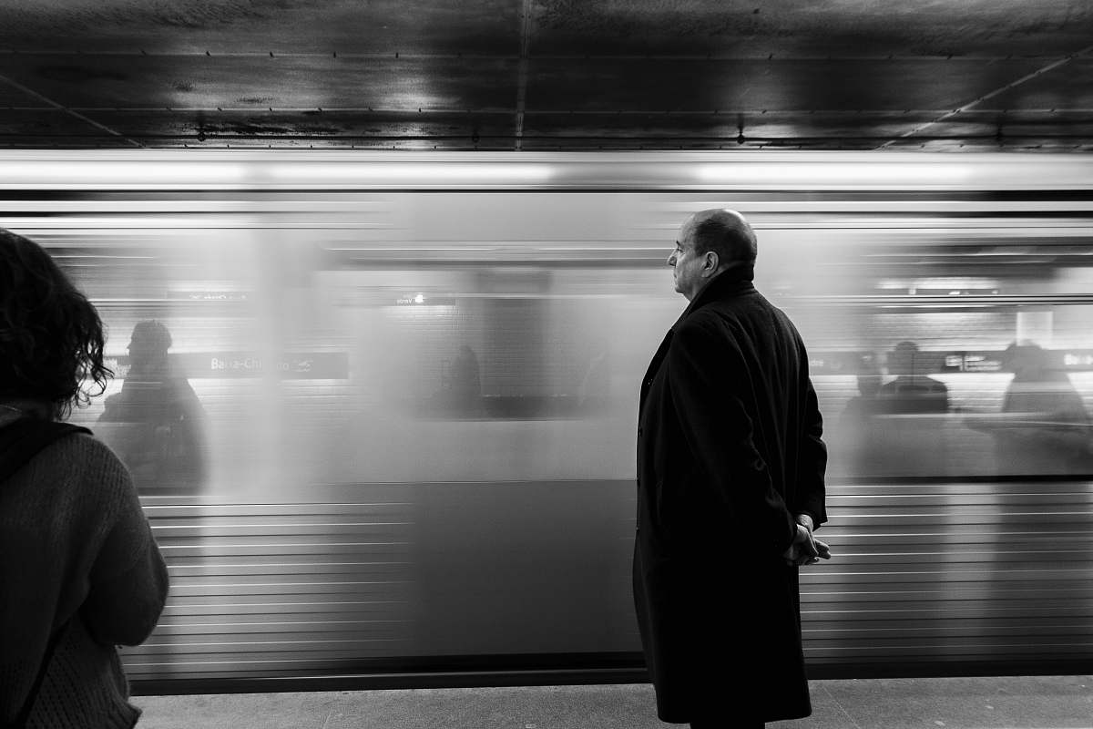 subway grayscaled photo of man train