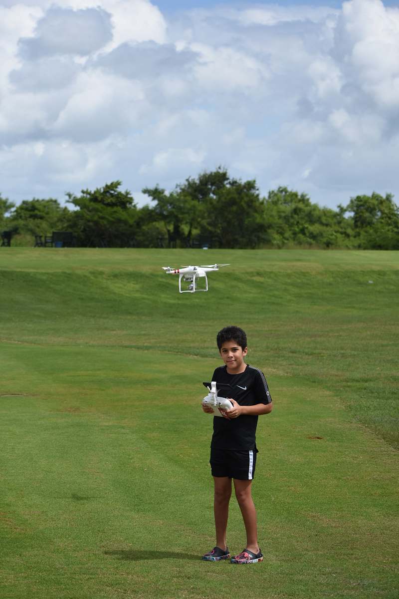 people boy standing on grass field person