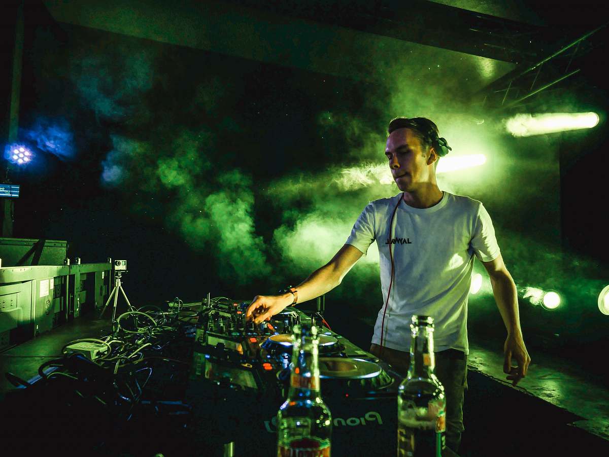 people DJ mixing sounds person
