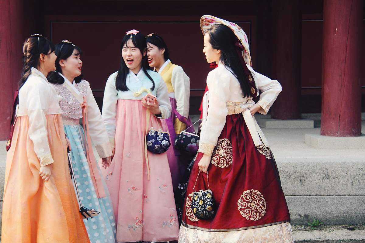 Capture the essence of culture and tradition with this stunning image featuring three women adorned in exquisite traditional Korean hanbok dresses. The vibrant colors and intricate designs of their attire tell a story of heritage and celebration, making it an ideal visual representation for cultural events, fashion articles, or travel blogs highlighting Korea's rich history. Perfect for showcasing female empowerment and diversity in fashion.