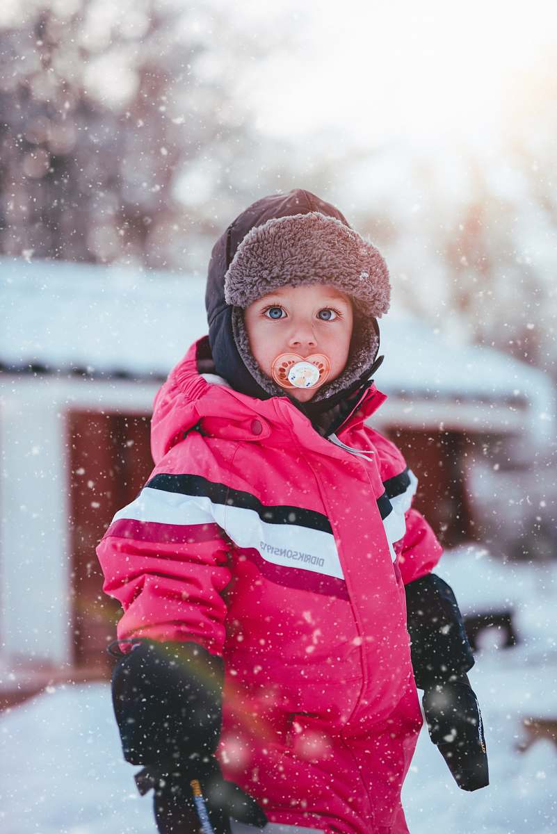 person macro photo boy in pink full-zip jacket and black beanie people